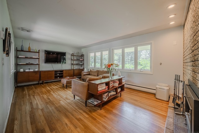 4 Northrop Rd, Woodbridge, CT 06525 - living area with baseboard heating, wood finished floors, and recessed lighting