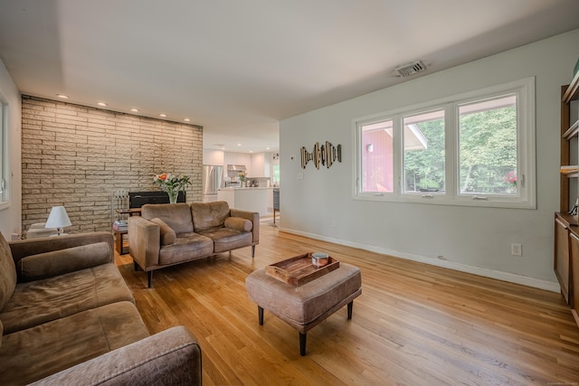 4 Northrop Rd, Woodbridge, CT 06525 - living room with light wood-type flooring and brick wall