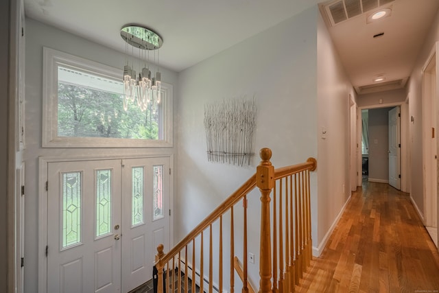 4 Northrop Rd, Woodbridge, CT 06525 - entryway with wood finished floors, plenty of natural light, a chandelier, and a baseboard radiator