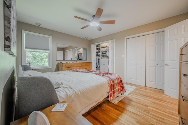 4 Northrop Rd, Woodbridge, CT 06525 - bedroom featuring light wood-style floors, ceiling fan, and multiple closets