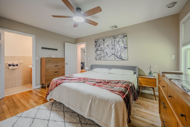 4 Northrop Rd, Woodbridge, CT 06525 - bedroom featuring light wood-type flooring, a ceiling fan, ensuite bath, and tile walls