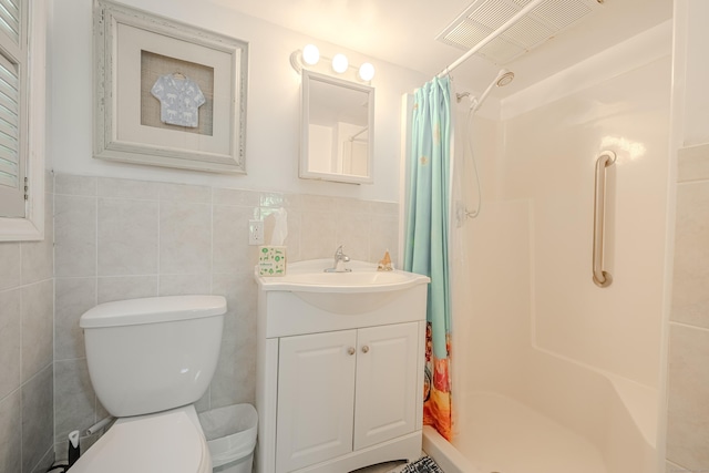 4 Northrop Rd, Woodbridge, CT 06525 - bathroom featuring a stall shower, vanity, tile walls, and wainscoting