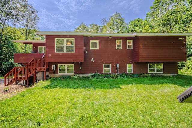 4 Northrop Rd, Woodbridge, CT 06525 - rear view of house with stairs and a lawn