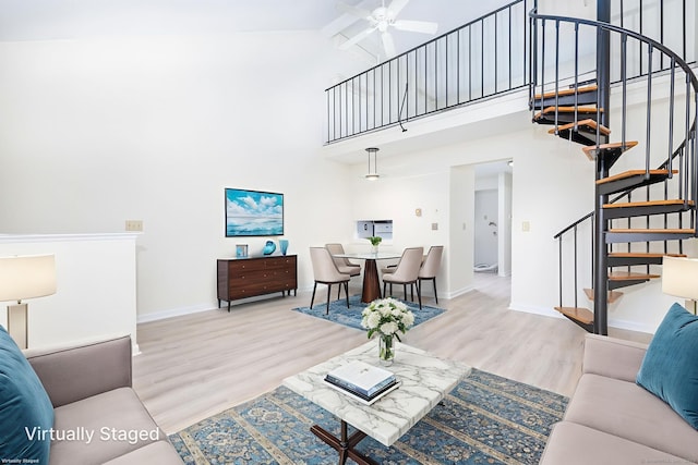 430 Emmett St Apt L, Bristol, CT 06010 - living room featuring stairs, high vaulted ceiling, wood finished floors, and ceiling fan
