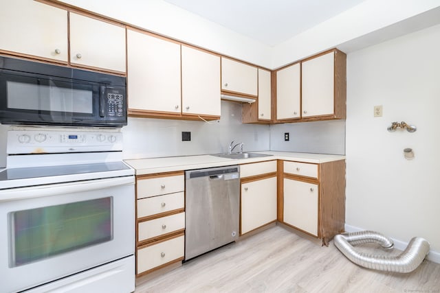 430 Emmett St Apt L, Bristol, CT 06010 - kitchen featuring stainless steel dishwasher, black microwave, electric stove, light wood finished floors, and light countertops