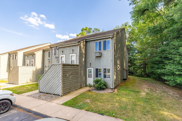 430 Emmett St Apt L, Bristol, CT 06010 - multi unit property with a front lawn, uncovered parking, and an AC wall unit