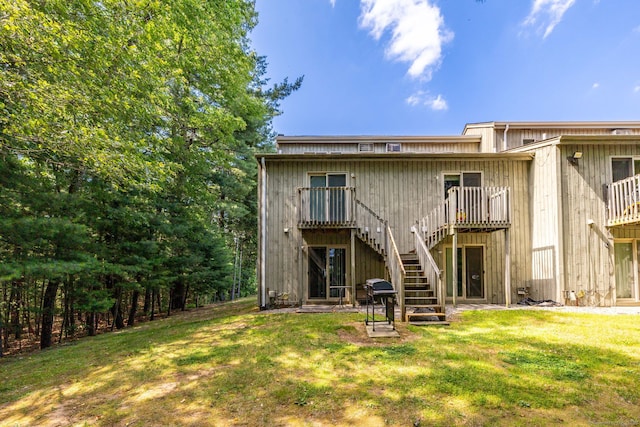 430 Emmett St Apt L, Bristol, CT 06010 - rear view of house with stairs, a yard, and a wooden deck