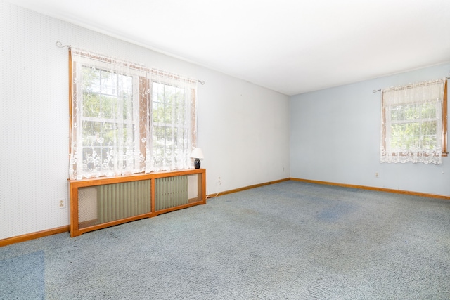 934 Jerome Ave, Bristol, CT 06010 - spare room featuring radiator heating unit, carpet flooring, and wallpapered walls