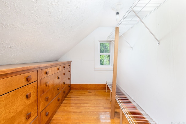 934 Jerome Ave, Bristol, CT 06010 - corridor featuring light wood finished floors, a textured ceiling, and lofted ceiling