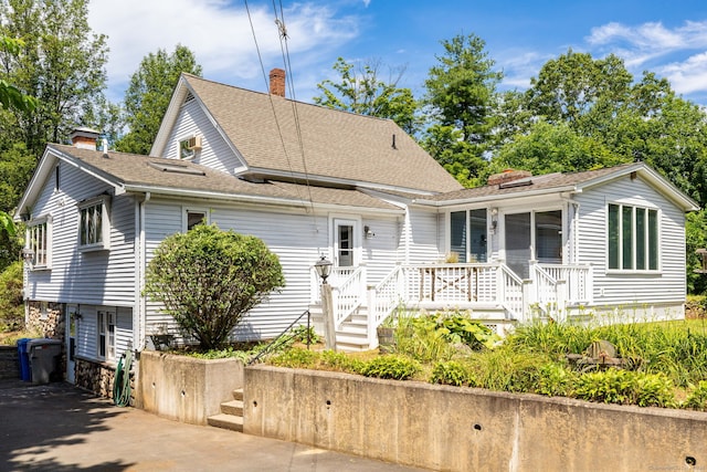 934 Jerome Ave, Bristol, CT 06010 - view of front facade with a chimney and roof with shingles