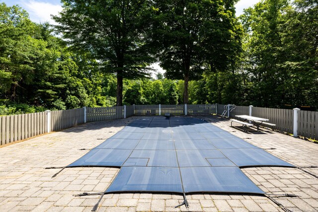 934 Jerome Ave, Bristol, CT 06010 - view of swimming pool with a patio area and view of wooded area