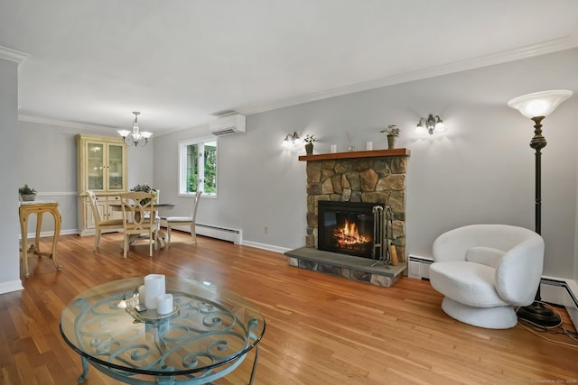 70 Bayne St, Norwalk, CT 06851 - living area featuring baseboard heating, a wall mounted AC, wood finished floors, ornamental molding, and a fireplace