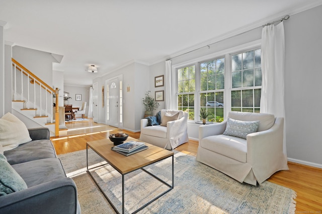 30 Poppy Ln, East Lyme, CT 06333 - living room featuring stairs, wood finished floors, and crown molding
