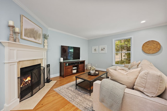 30 Poppy Ln, East Lyme, CT 06333 - living area featuring a fireplace with flush hearth, ornamental molding, light wood-type flooring, and recessed lighting