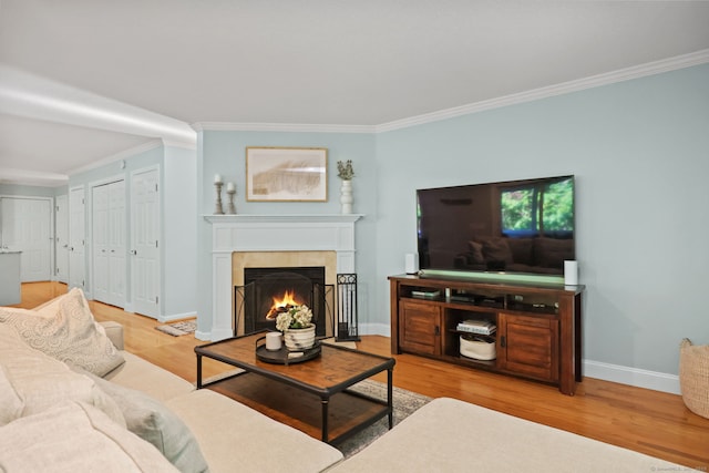 30 Poppy Ln, East Lyme, CT 06333 - living area with ornamental molding, wood finished floors, and a fireplace