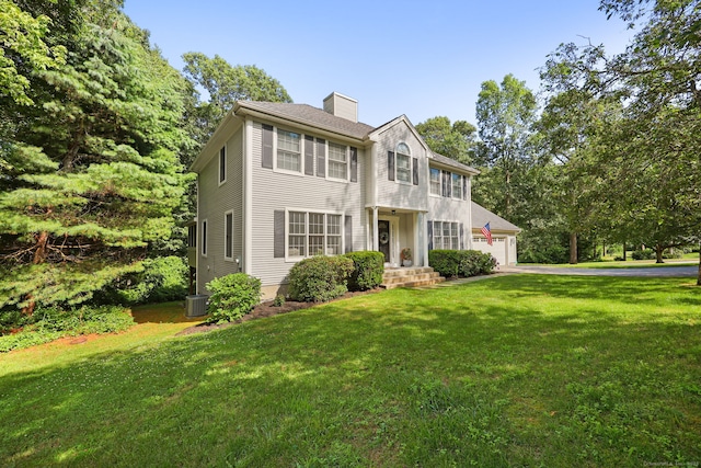 30 Poppy Ln, East Lyme, CT 06333 - colonial inspired home featuring a chimney and a front lawn