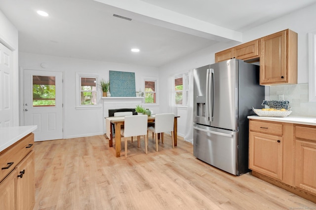112 Lake Rd, Andover, CT 06232 - kitchen with stainless steel fridge with ice dispenser, light wood-type flooring, light countertops, recessed lighting, and backsplash