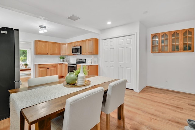 112 Lake Rd, Andover, CT 06232 - kitchen featuring appliances with stainless steel finishes, light countertops, light wood-style floors, and recessed lighting