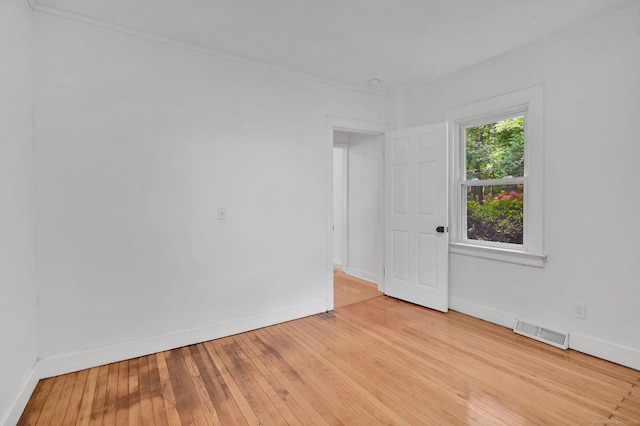 112 Lake Rd, Andover, CT 06232 - spare room with light wood finished floors and ornamental molding