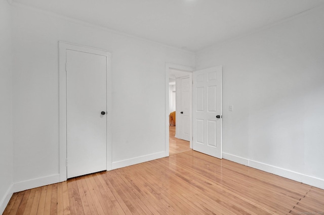 112 Lake Rd, Andover, CT 06232 - unfurnished bedroom with light wood-type flooring and baseboards