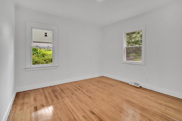 112 Lake Rd, Andover, CT 06232 - empty room with healthy amount of natural light and light wood finished floors