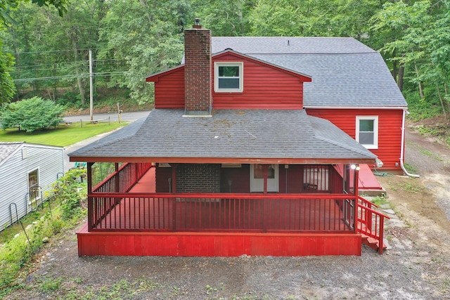 112 Lake Rd, Andover, CT 06232 - back of house with roof with shingles and a chimney
