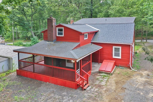 112 Lake Rd, Andover, CT 06232 - back of property featuring a shingled roof and a chimney