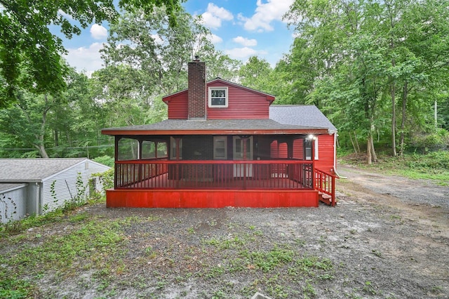 112 Lake Rd, Andover, CT 06232 - view of front of house featuring a shingled roof and a chimney