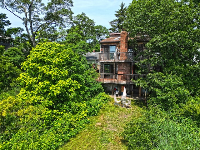 25 Summer Pl, Milford, CT 06460 - back of property featuring a chimney, a balcony, and a wooden deck