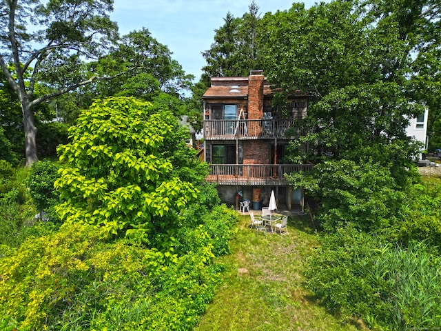 25 Summer Pl, Milford, CT 06460 - rear view of house with a chimney and a balcony