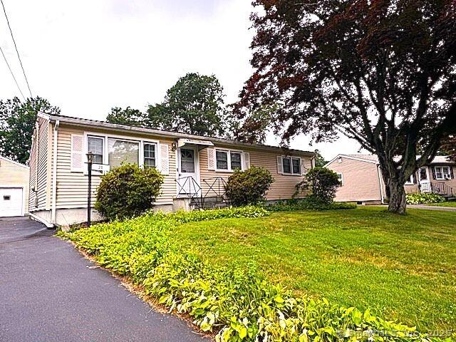 21 Eastwood Rd, Bridgeport, CT 06606 - ranch-style house featuring a front yard and an outbuilding