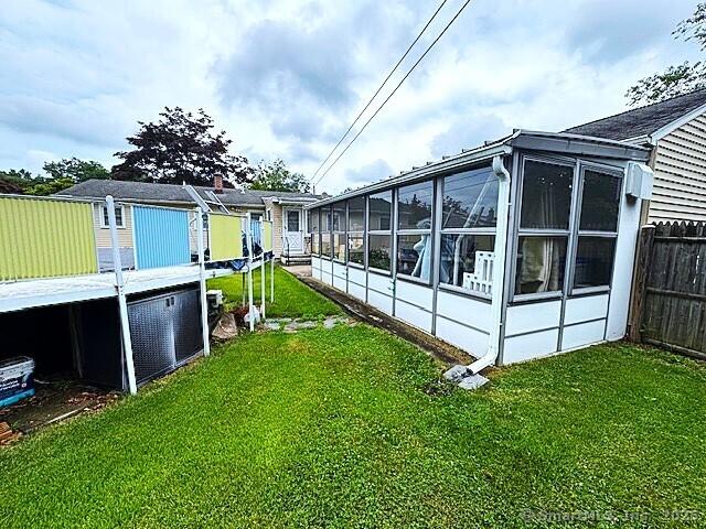 21 Eastwood Rd, Bridgeport, CT 06606 - rear view of house with a sunroom