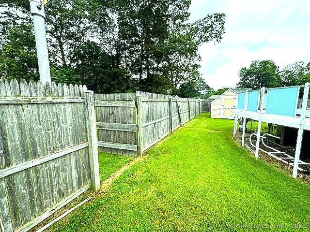 21 Eastwood Rd, Bridgeport, CT 06606 - fenced backyard with a shed