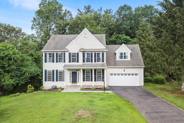 50 Buckingham Rd, Avon, CT 06001 - colonial home with driveway, a front yard, a porch, an attached garage, and a shingled roof