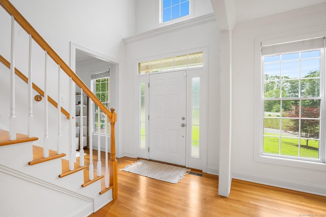 50 Buckingham Rd, Avon, CT 06001 - foyer with light wood-style flooring and stairs