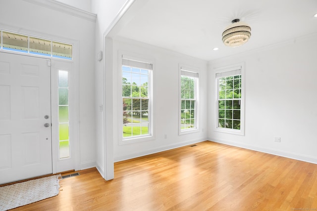 50 Buckingham Rd, Avon, CT 06001 - foyer featuring light wood-style floors and crown molding