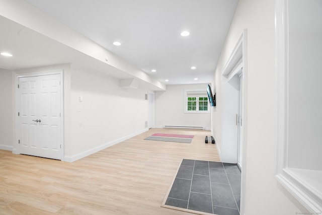 50 Buckingham Rd, Avon, CT 06001 - basement with a baseboard heating unit, wood finished floors, and recessed lighting