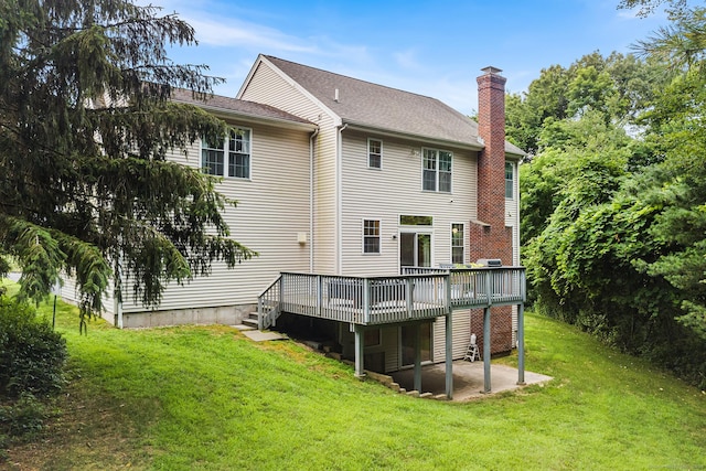 50 Buckingham Rd, Avon, CT 06001 - rear view of property featuring a chimney, a deck, a patio area, a lawn, and roof with shingles