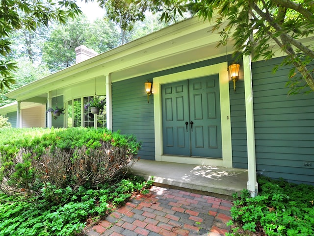 3 Carriage Dr, Canton, CT 06019 - doorway to property featuring a chimney and a porch