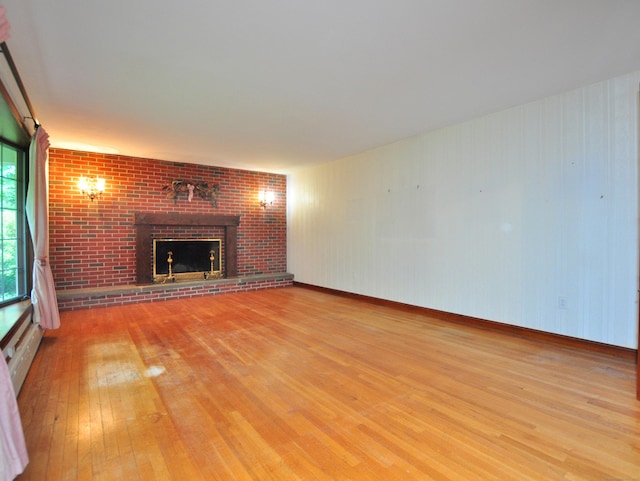3 Carriage Dr, Canton, CT 06019 - unfurnished living room with light wood-style flooring and a fireplace