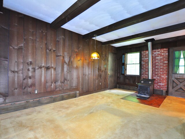 3 Carriage Dr, Canton, CT 06019 - living room with a wood stove, wood walls, healthy amount of natural light, and beamed ceiling