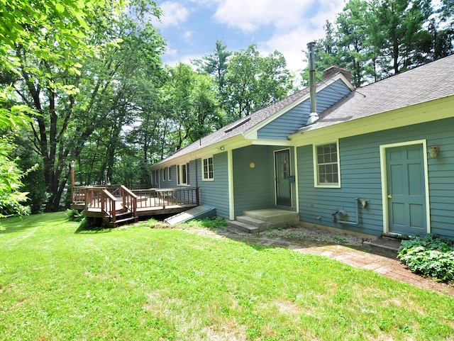 3 Carriage Dr, Canton, CT 06019 - back of property with a chimney, a lawn, a wooden deck, and a shingled roof