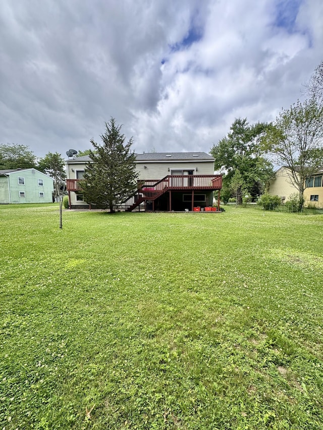 70 Regency Dr, Windsor, CT 06095 - view of green lawn with a wooden deck and stairway