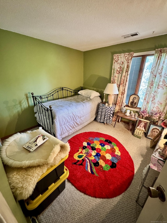 70 Regency Dr, Windsor, CT 06095 - carpeted bedroom with a textured ceiling