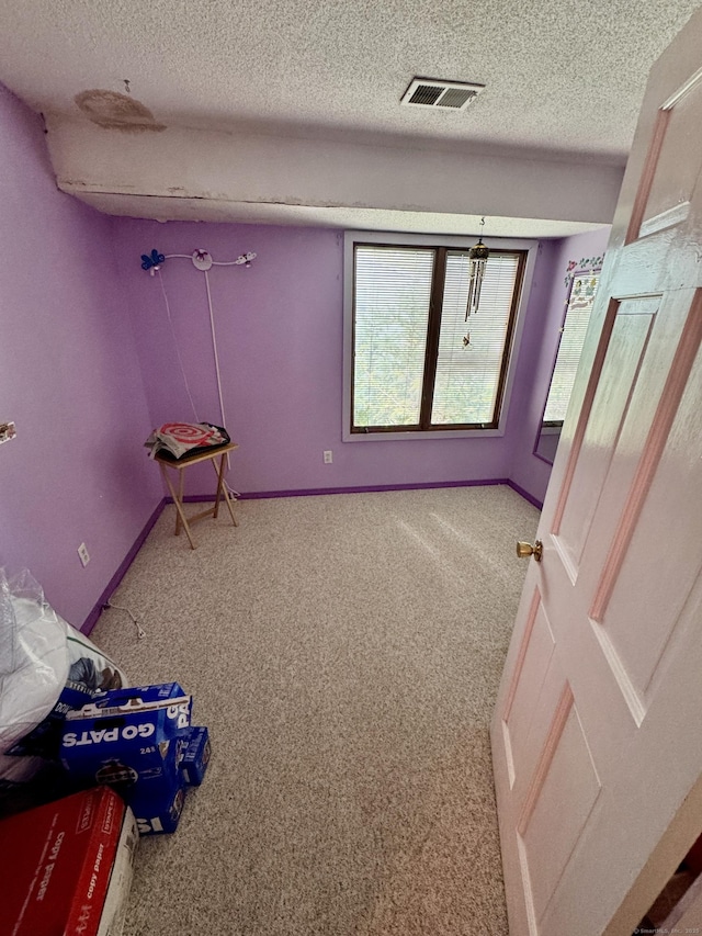70 Regency Dr, Windsor, CT 06095 - unfurnished bedroom featuring a textured ceiling and carpet floors