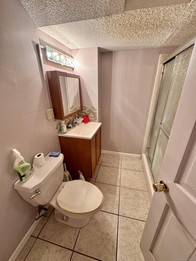 70 Regency Dr, Windsor, CT 06095 - bathroom featuring a textured ceiling, a shower with door, tile patterned floors, and vanity