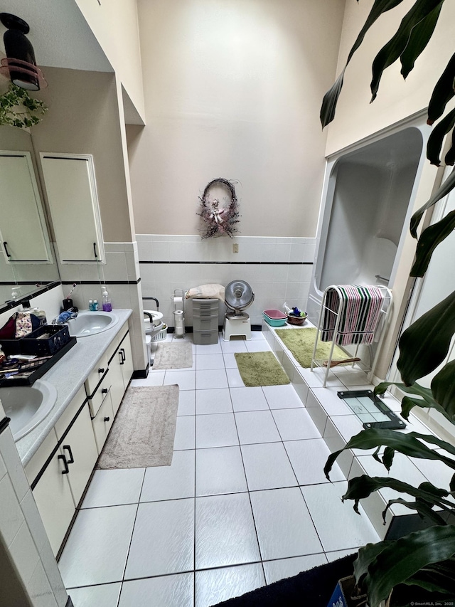 70 Regency Dr, Windsor, CT 06095 - bathroom featuring tile patterned flooring, double vanity, and wainscoting
