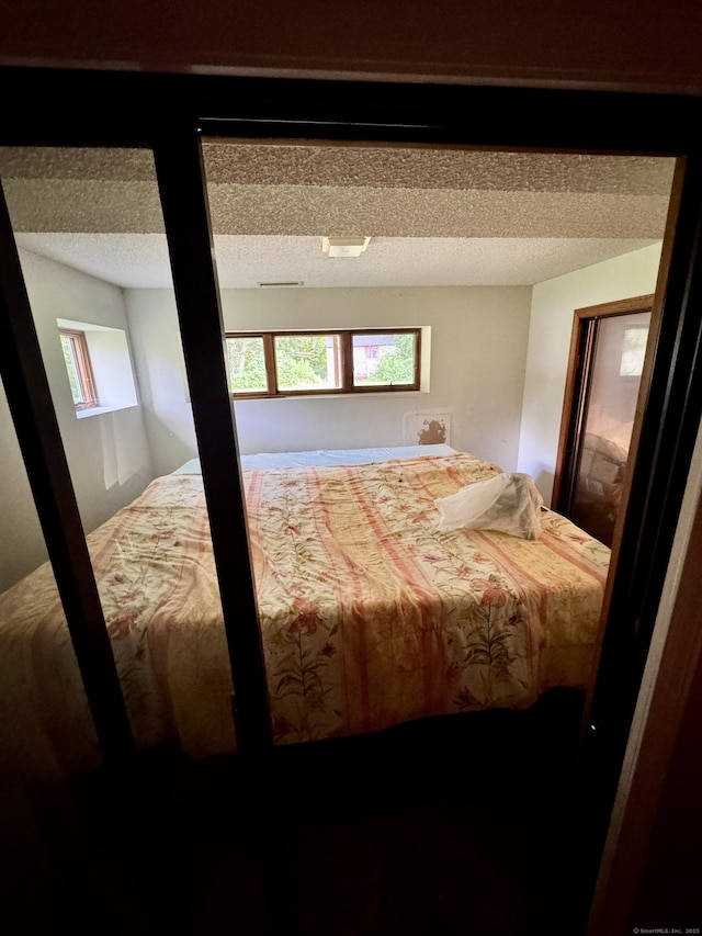 70 Regency Dr, Windsor, CT 06095 - bedroom with a textured ceiling