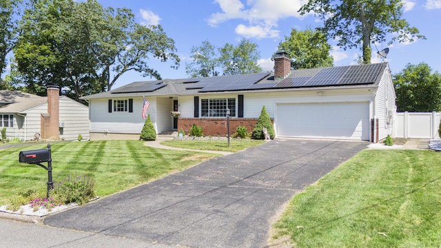 24 Pine Tree Rdg, Meriden, CT 06450 - ranch-style home featuring a garage, solar panels, brick siding, and driveway