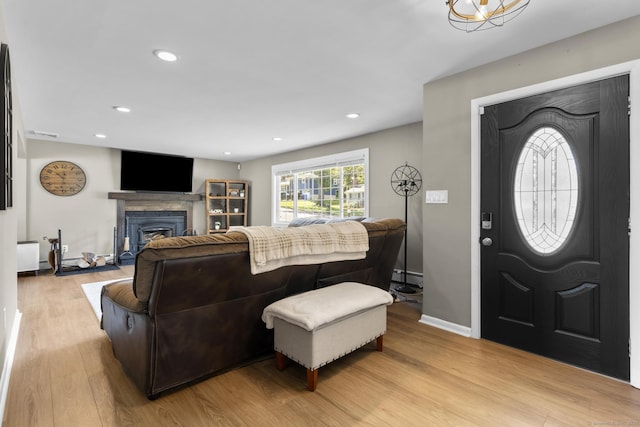 24 Pine Tree Rdg, Meriden, CT 06450 - living area featuring baseboard heating, light wood finished floors, a fireplace, and recessed lighting
